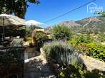Casa histórica de piedra con azotea en Bunyola, 125m², 3 dormitorios, 2 baños, suite de invitados, jardín, chimenea - Gartenausblick